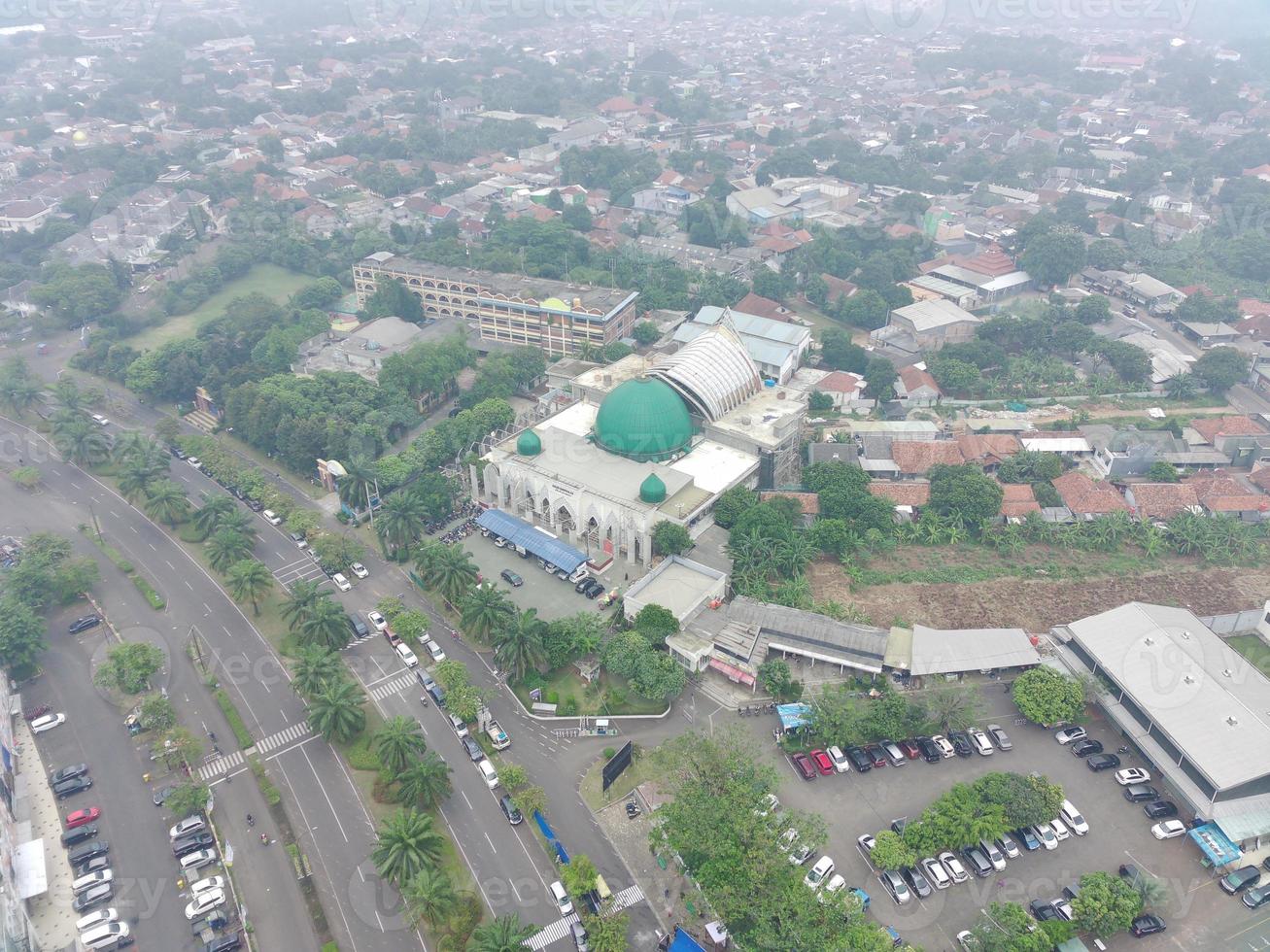 aerial view of the Darusalam mosque on the side of the highway. photo