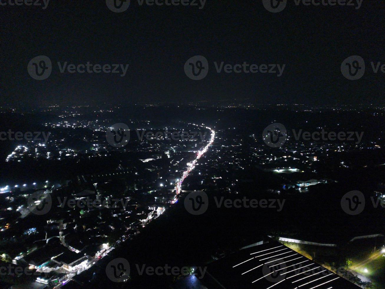 aerial view of office building and warehouse distribution center of retail based company at night. photo