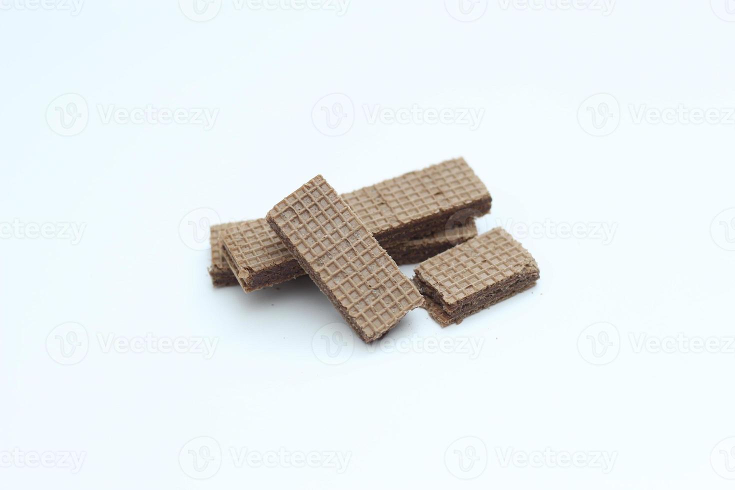 a close up of chocolate wafers isolated on white background. photo