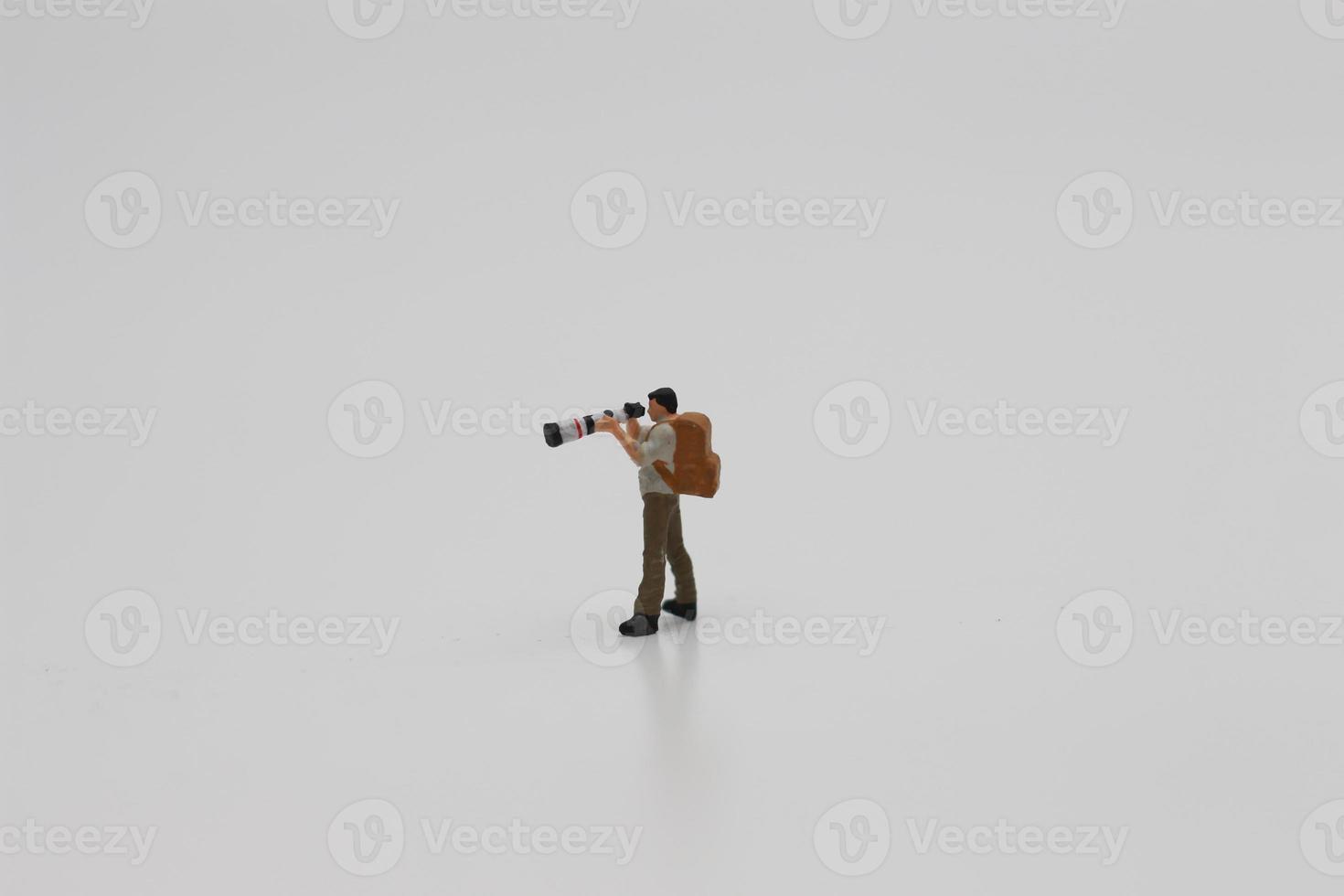 a close up of a miniature figure of a photographer photo