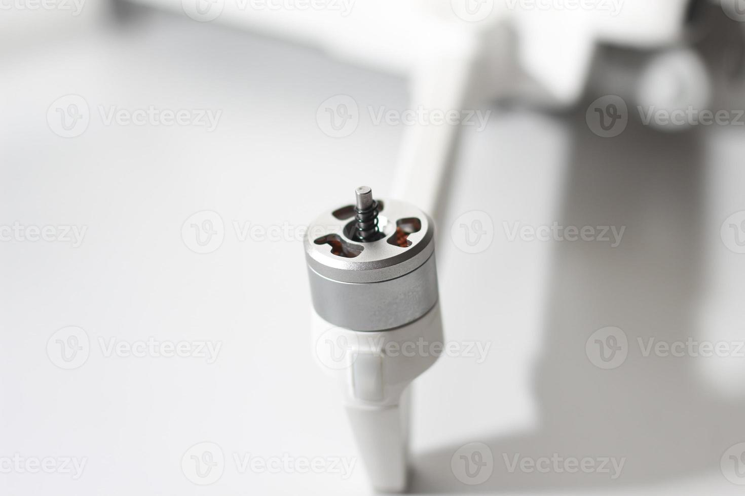 a close up of detailed white drone parts photo