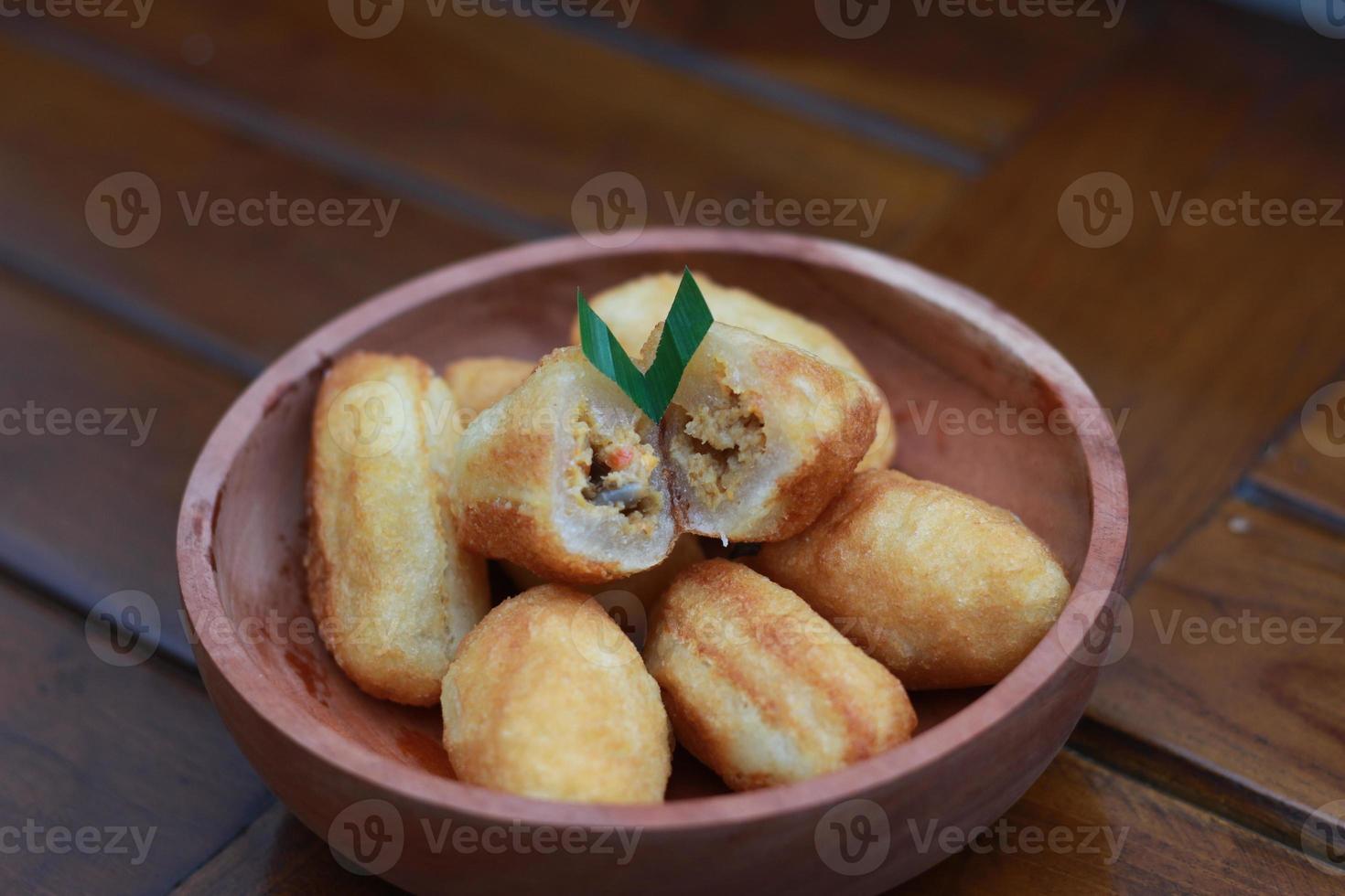 Comro or combro, a traditional Javanese snack made of deep fried grated cassava filled with a savory mix of oncom or fermented soy bean cake and chili photo