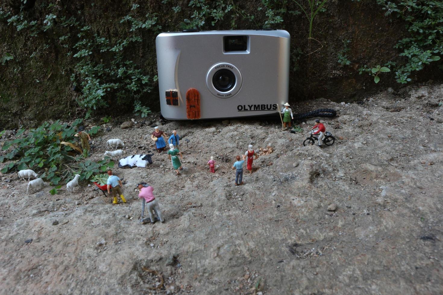 Bogor, Indonesia - October, 22 2022. Miniature figure of crowds of people with their respective activities. Concept of social life. photo