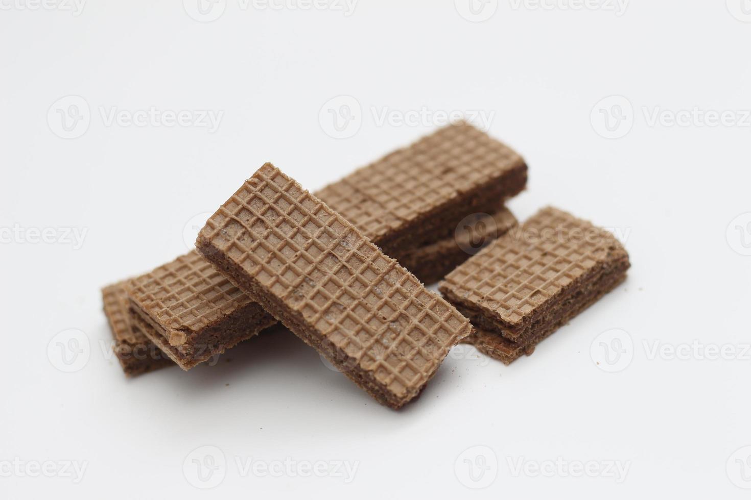 a close up of chocolate wafers isolated on white background. photo