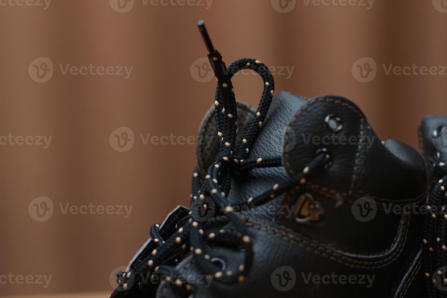 Detailed photo of a pair of safety shoes for work. Work protective equipment concept photo.