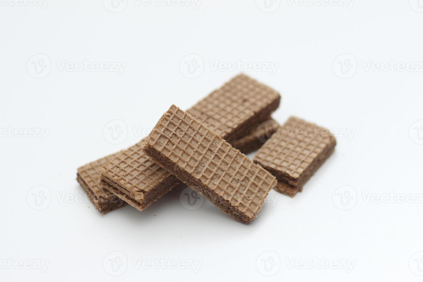 a close up of chocolate wafers isolated on white background. photo