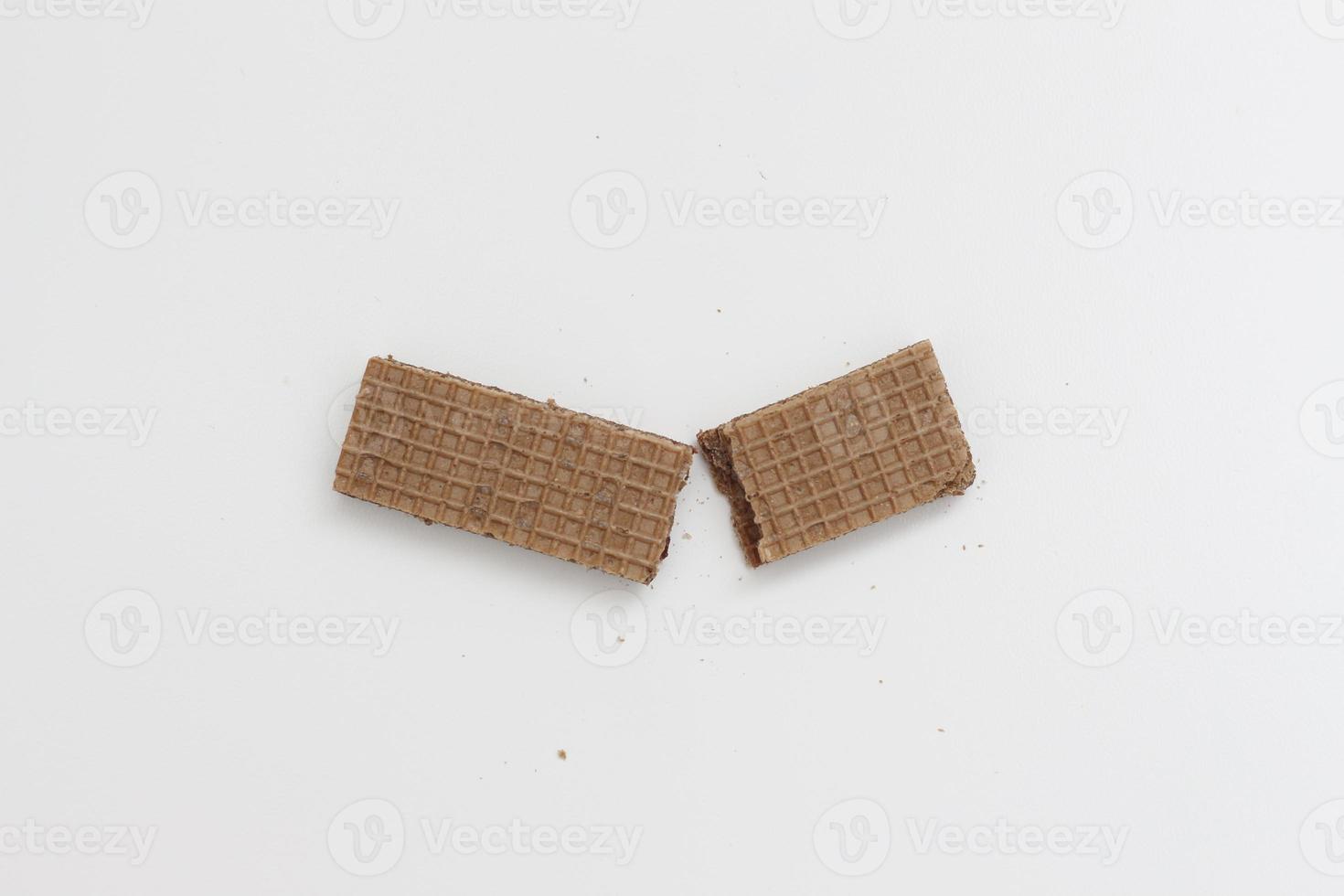 a close up of chocolate wafers isolated on white background. photo