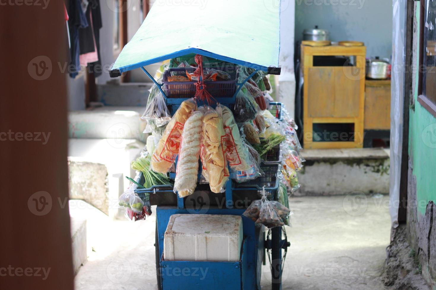 a mobile vegetable seller with a cart photo