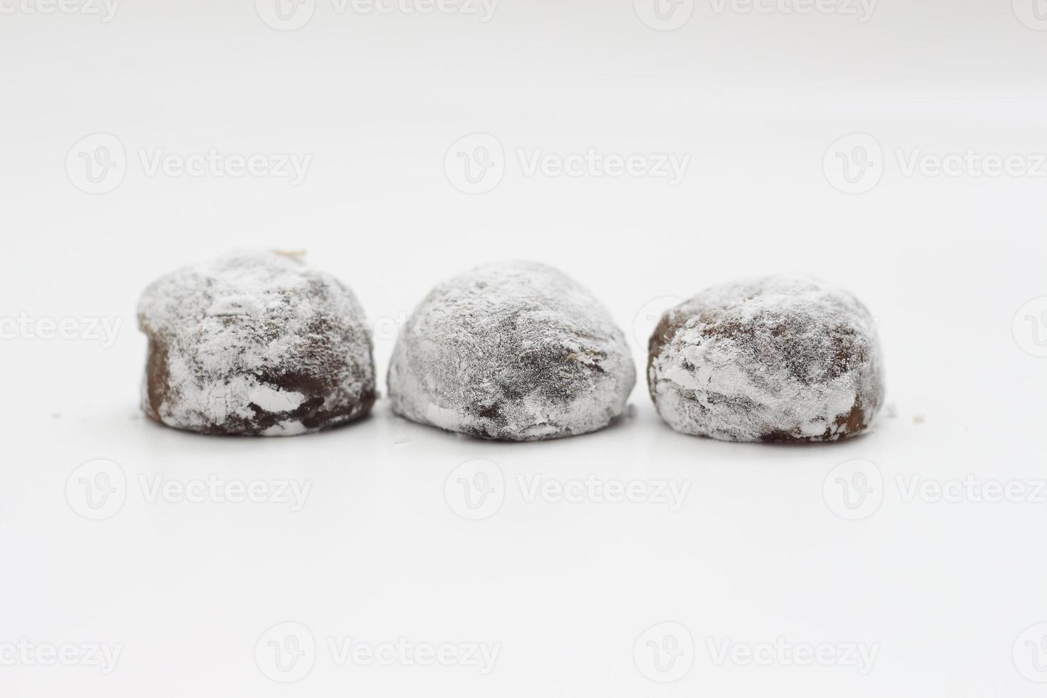 a close up of chocolate flavored mochi isolated on white background. photo