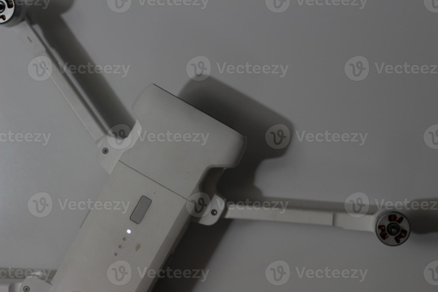 a close up of detailed white drone parts photo