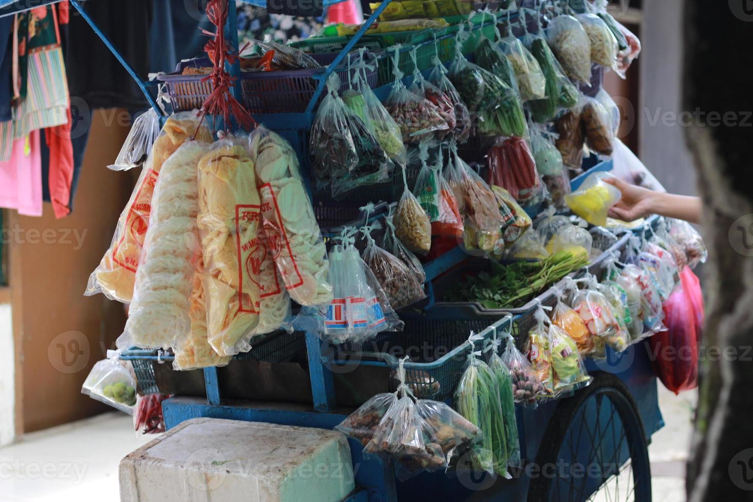 a mobile vegetable seller with a cart photo