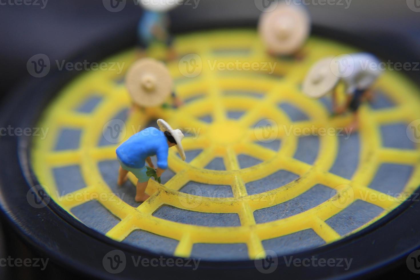 photo of a miniature figure with the concept of a farmer farming on a respirator.