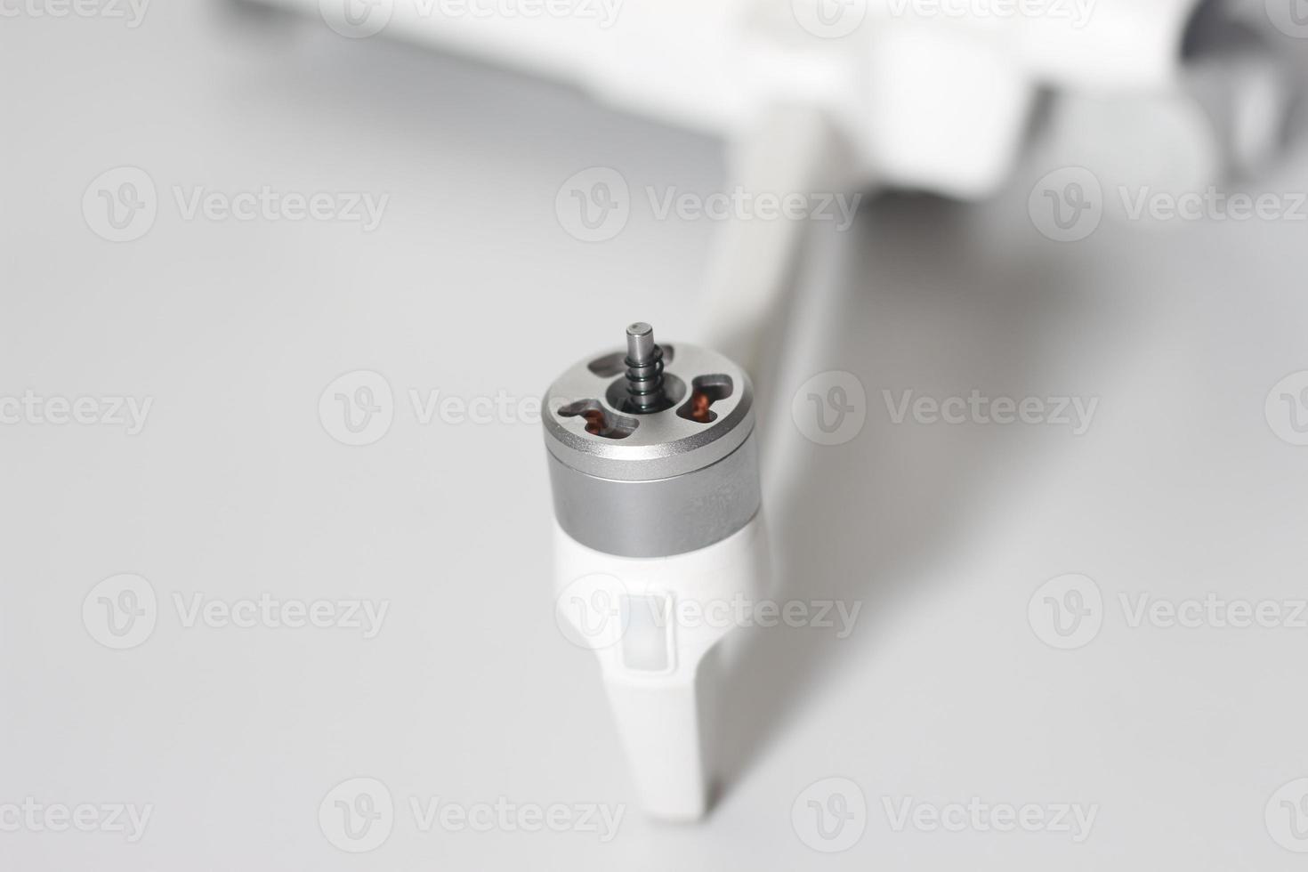 a close up of detailed white drone parts photo