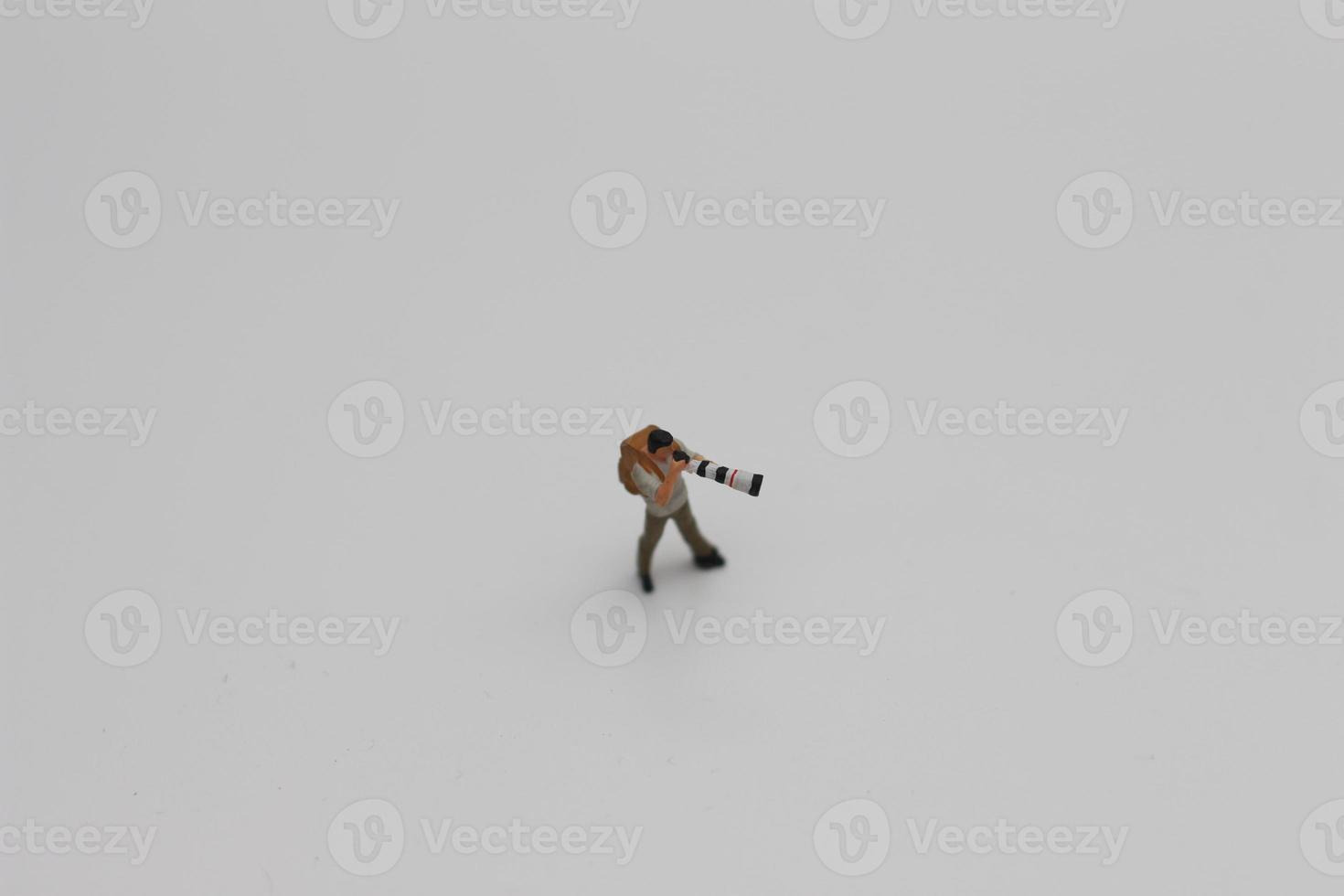 a close up of a miniature figure of a photographer photo