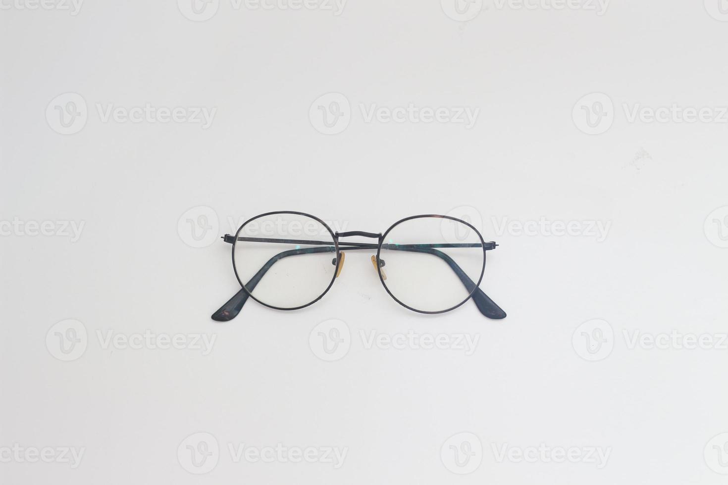 a close up of eyeglasses with black frames isolated on white background photo