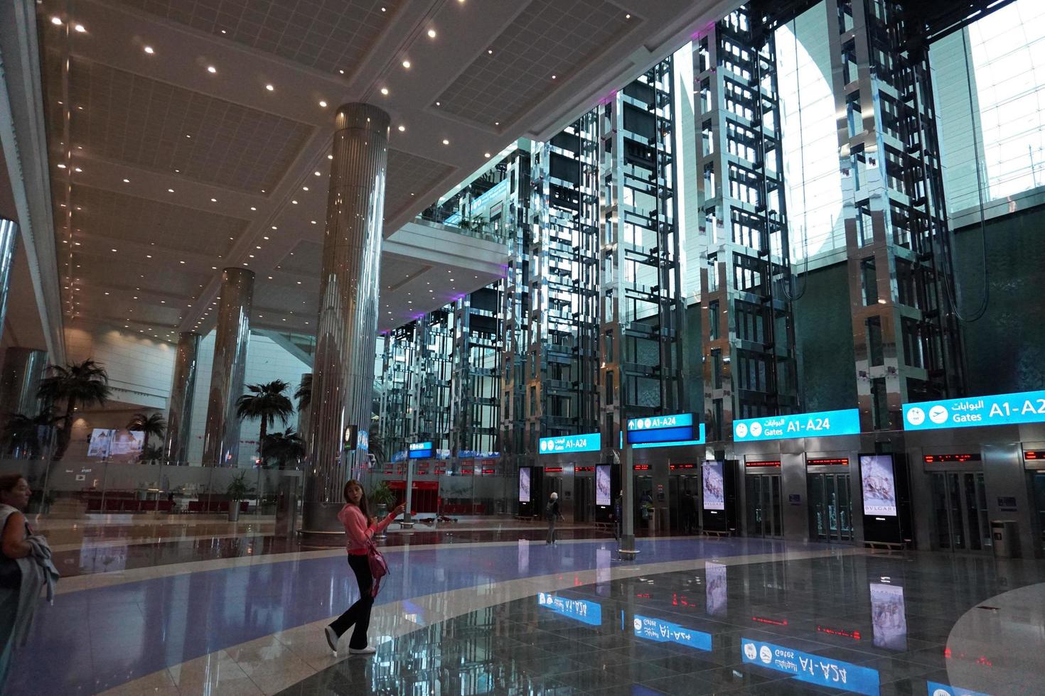 DUBAI, UAE - AUGUST 14 2017 - Travellers at Dubai Airport photo