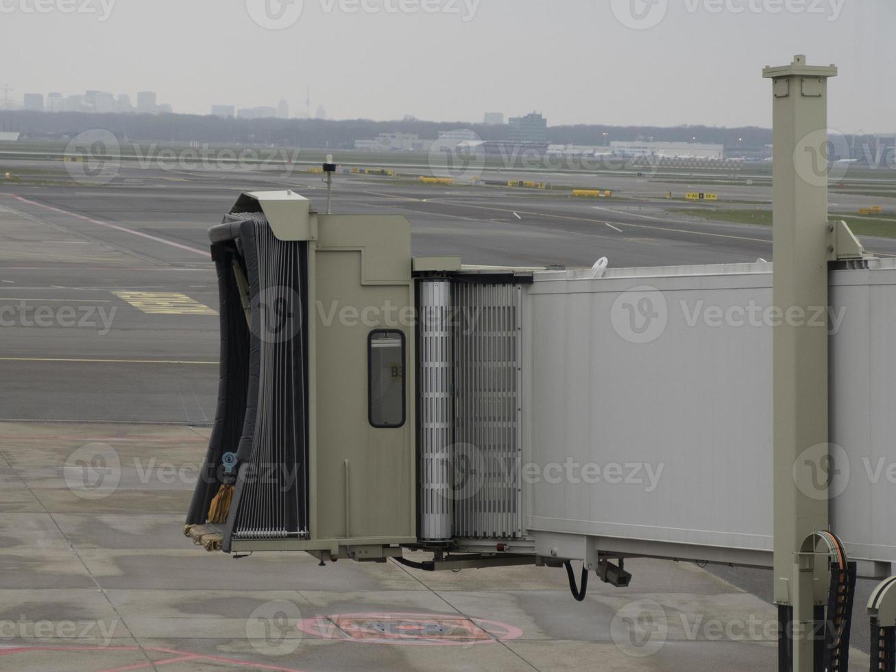 Access gangway to the aircraft tunnel from terminal to plane photo