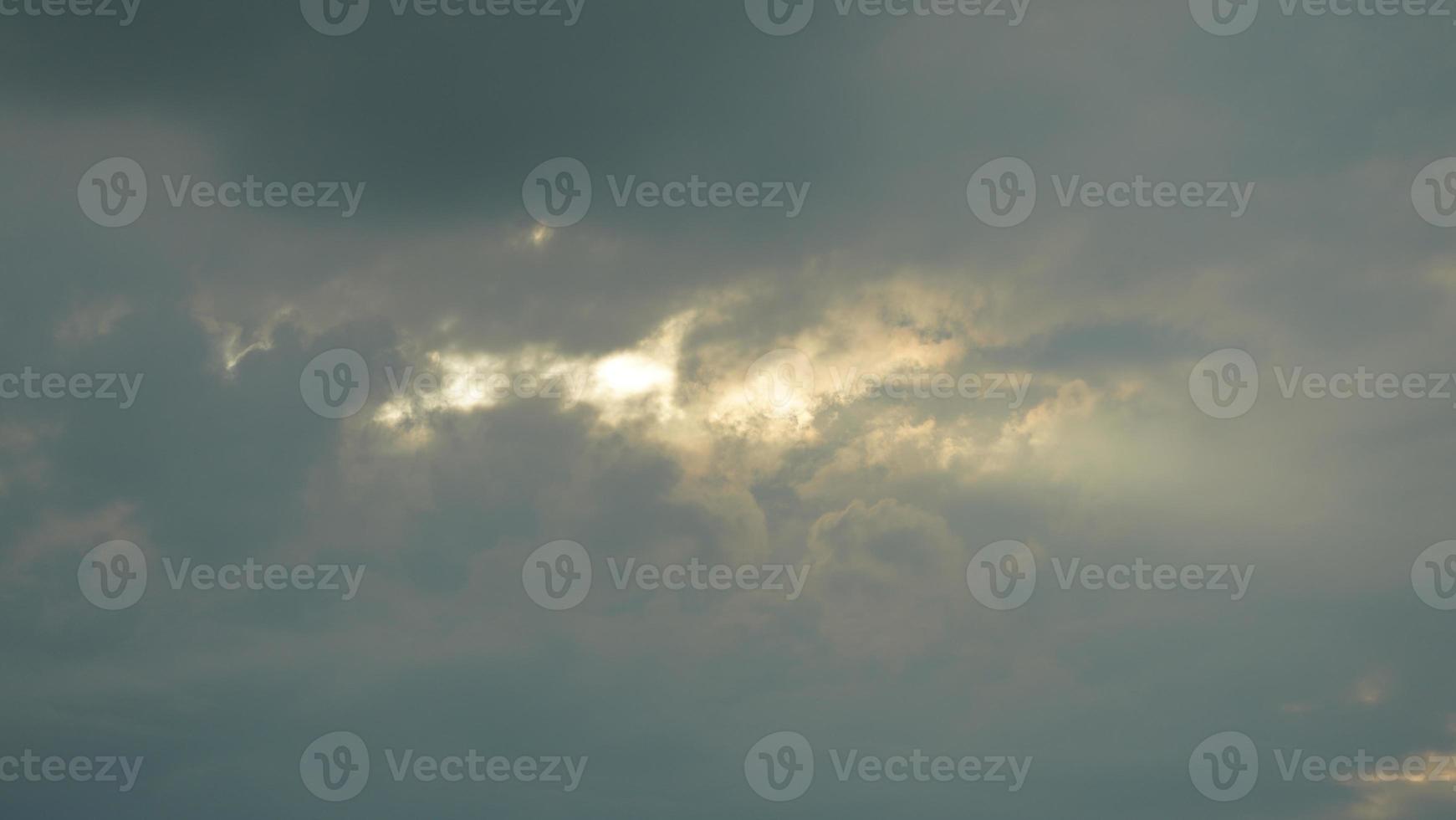 The beautiful sunset sky view with the colorful clouds and warm lights in the sky photo