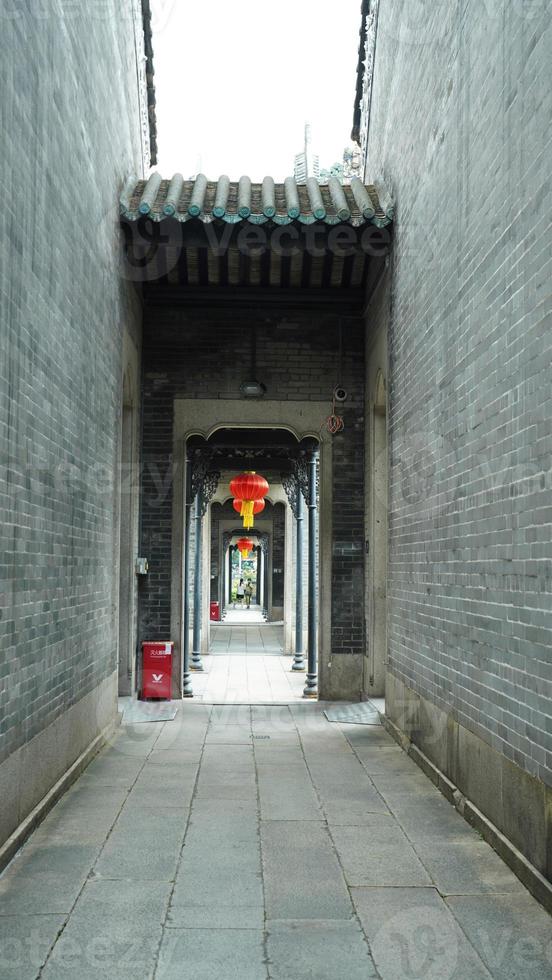 The old Chinese school buildings located in Guangzhou city of the China with the beautiful stone and wooden sculpture photo