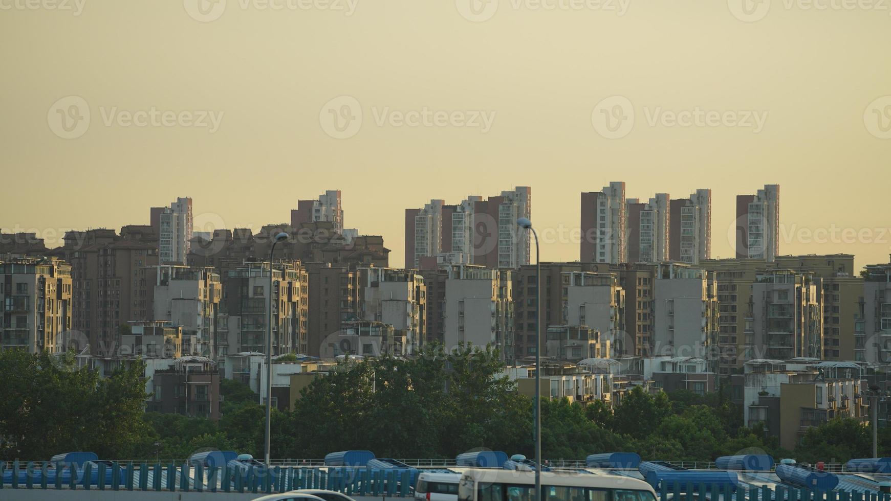 The city view with the sunset warm sunlight on the buildings in China photo