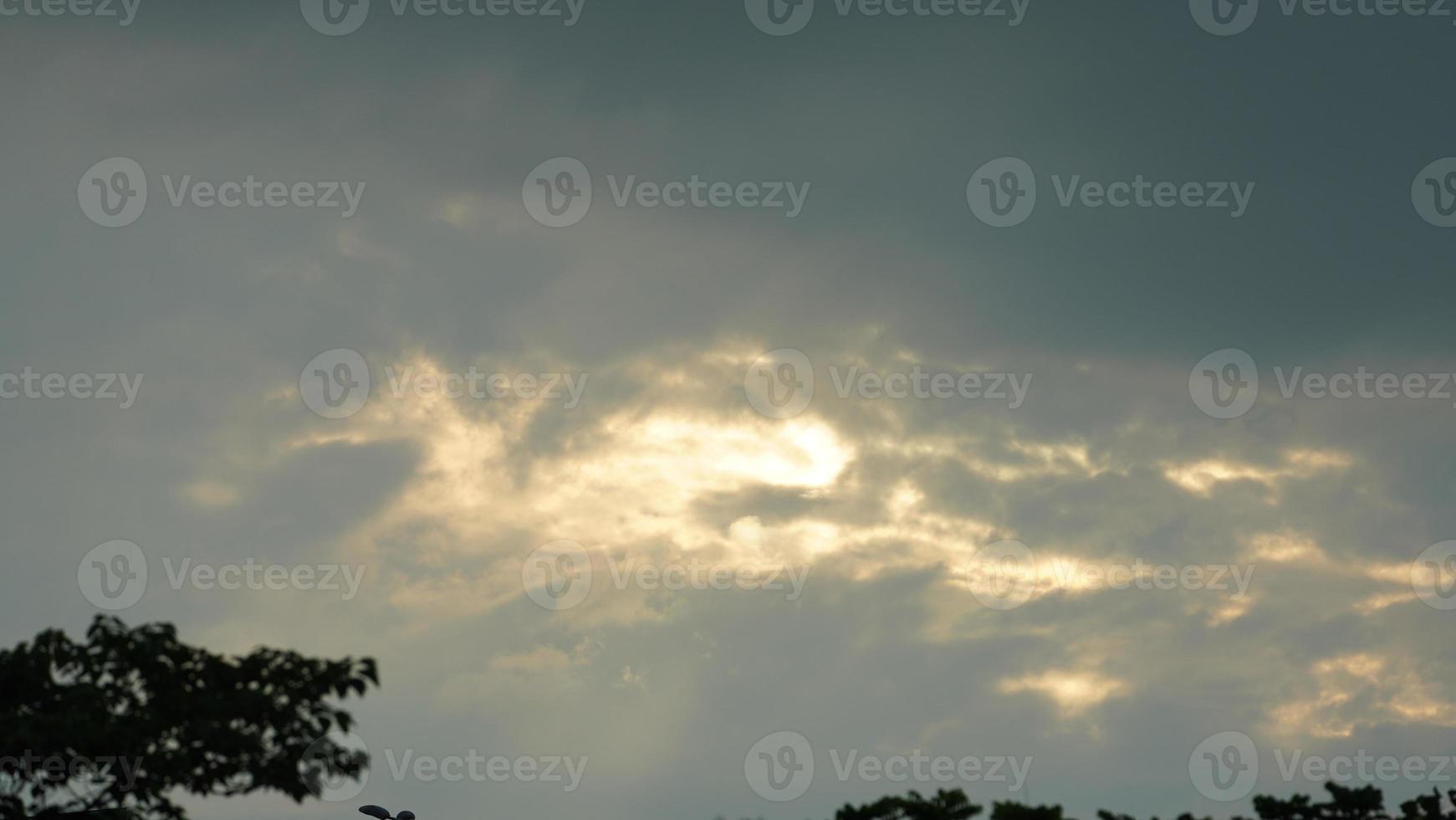 The beautiful sunset sky view with the colorful clouds and warm lights in the sky photo