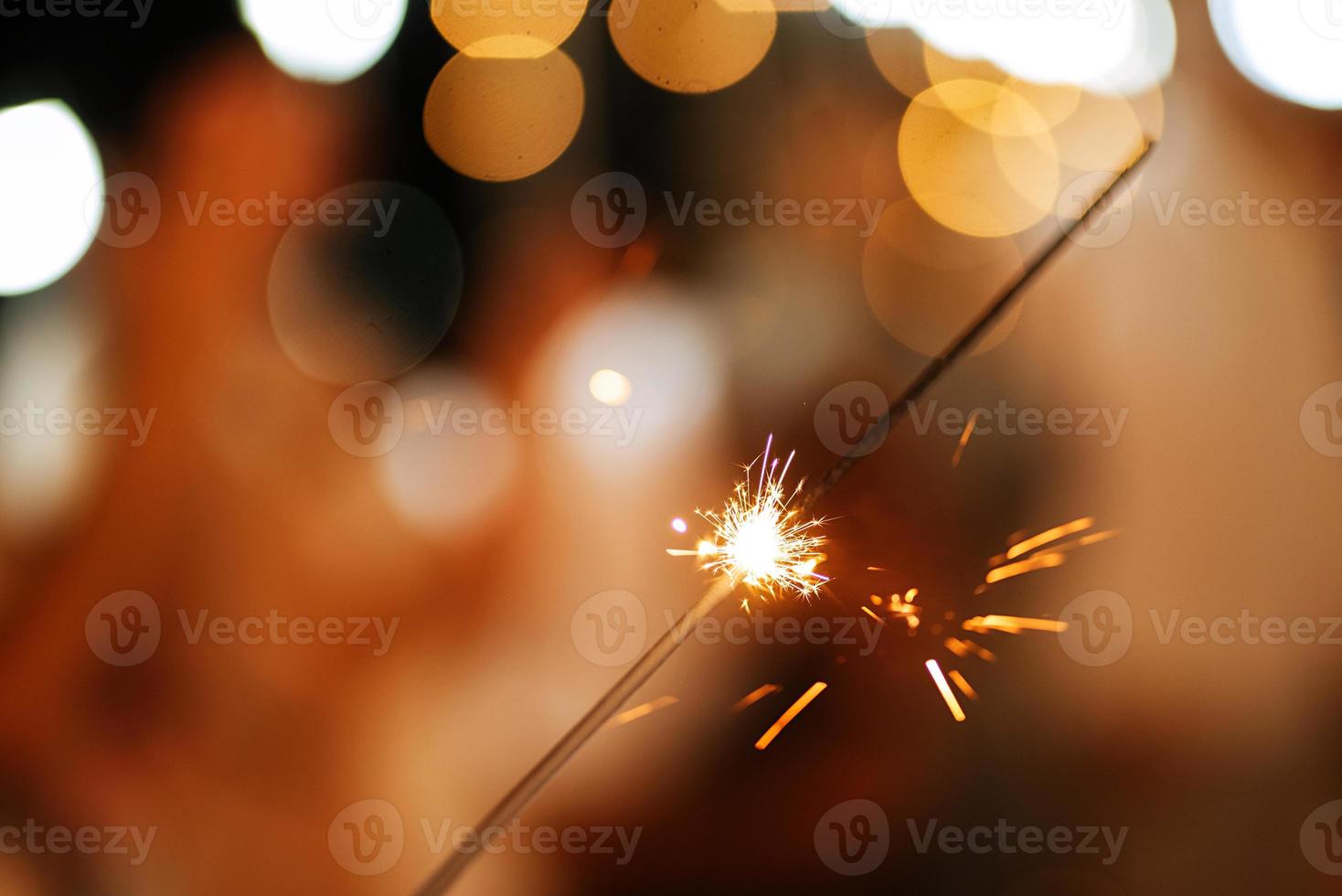 newlyweds at a wedding of sparklers photo