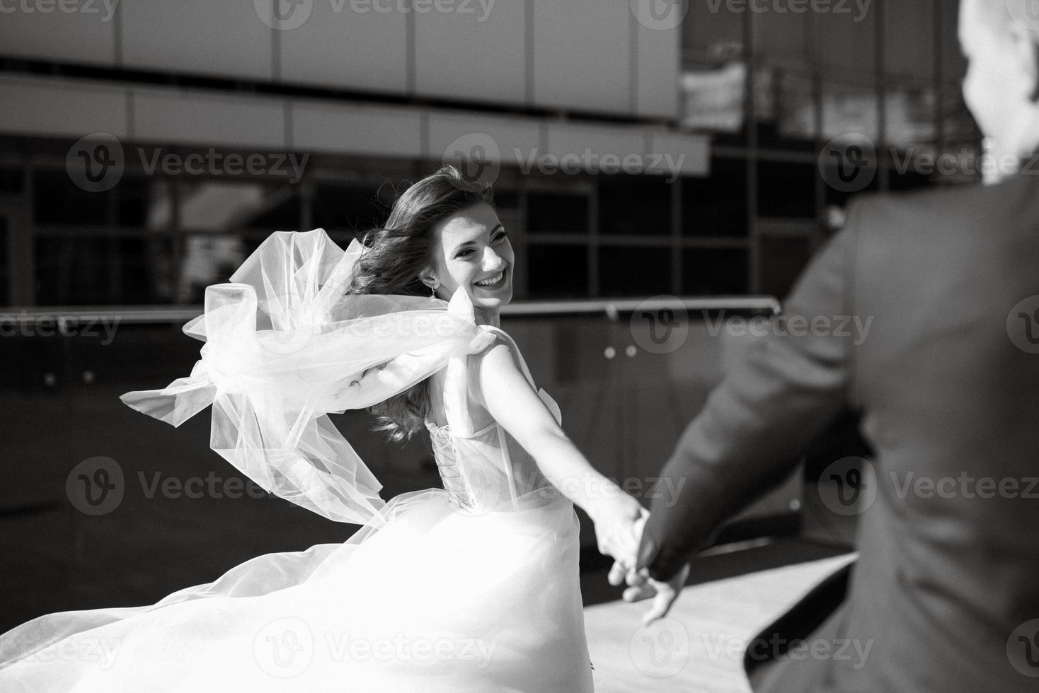 bride and groom first meeting on the roof of skyscraper photo