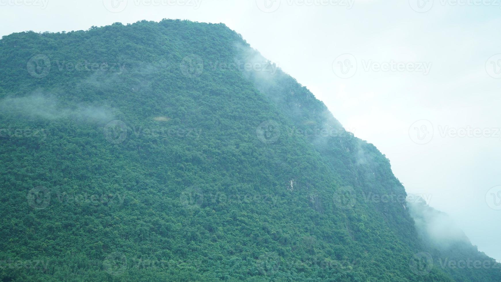 The beautiful mountains view with the fog during the rainy day photo
