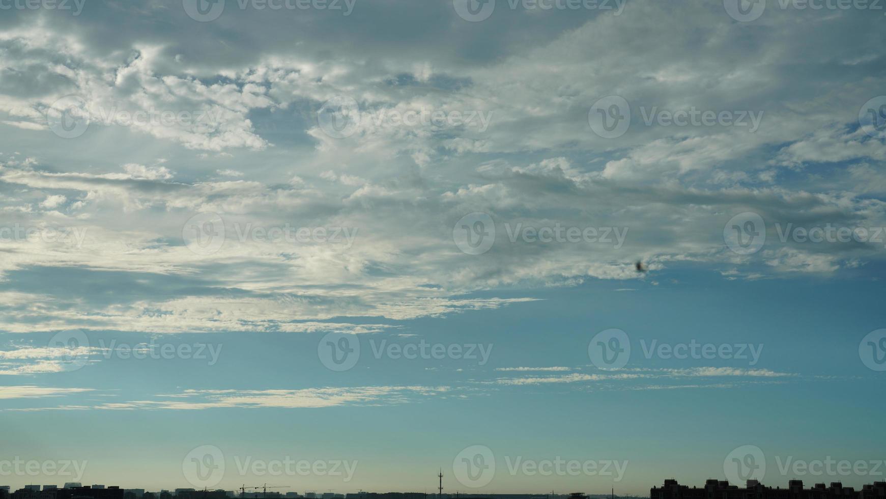 The beautiful sunset sky view with the colorful clouds and warm lights in the sky photo