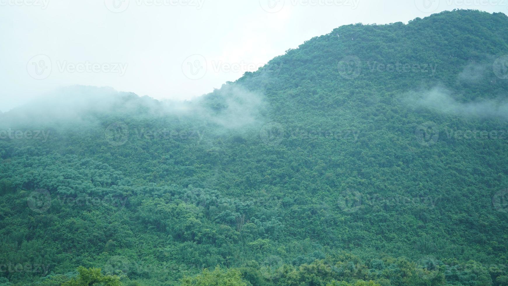 The beautiful mountains view with the fog during the rainy day photo