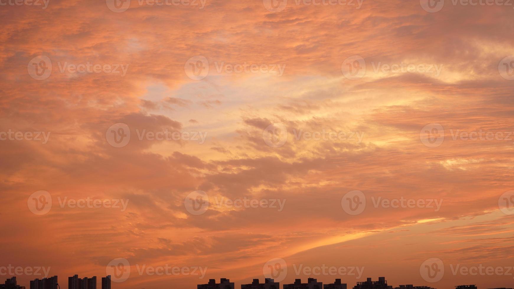 The beautiful sunset sky view with the colorful clouds and warm lights