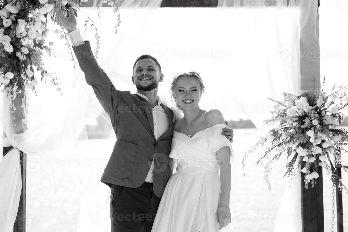 wedding ceremony on a high pier near the river photo