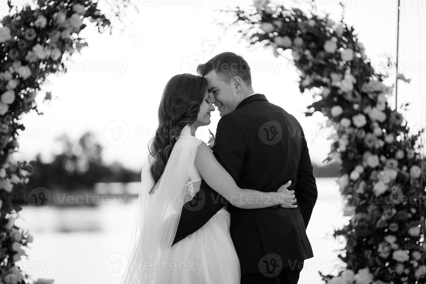 bride and groom against the backdrop of a yellow sunset photo