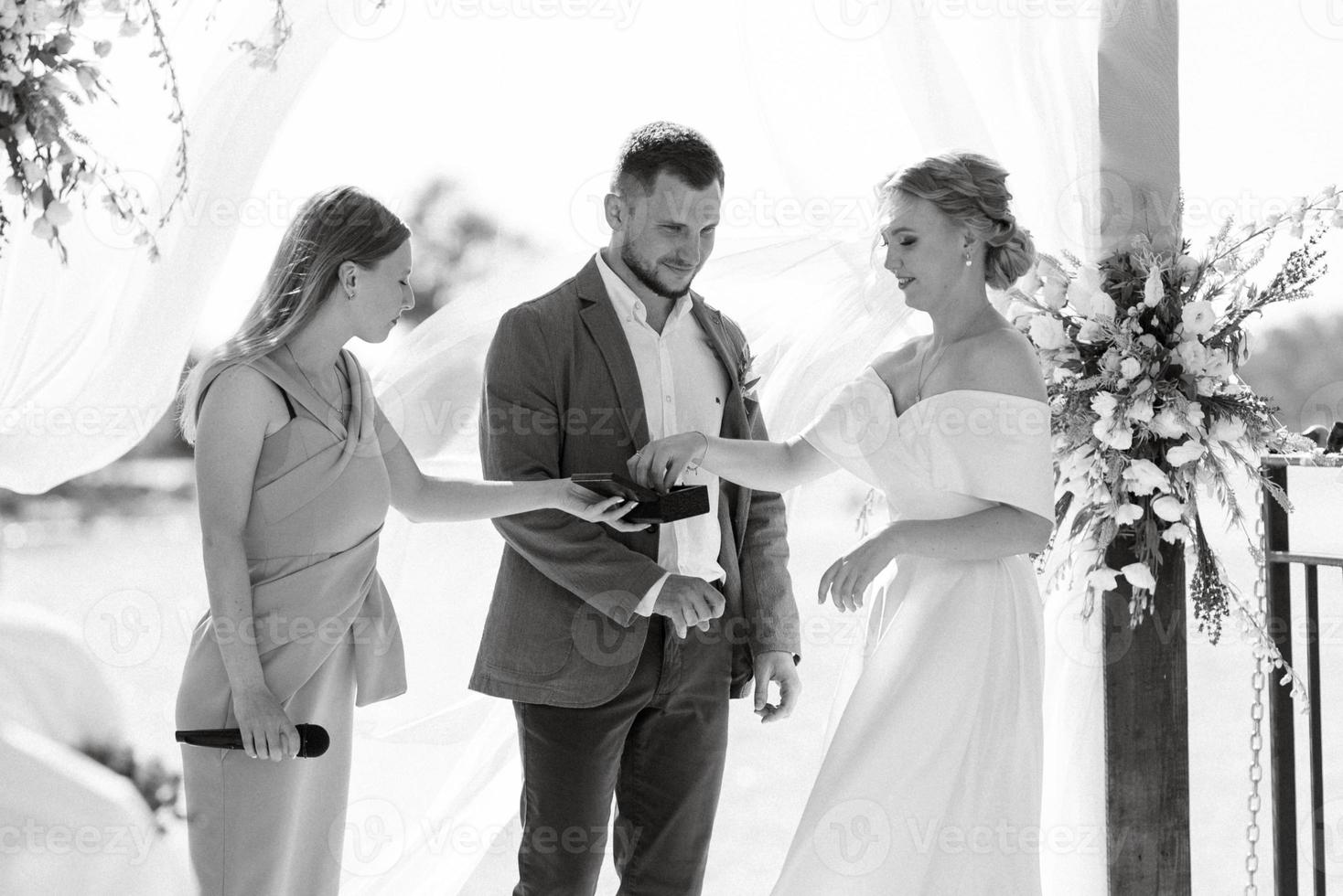 wedding ceremony on a high pier near the river photo