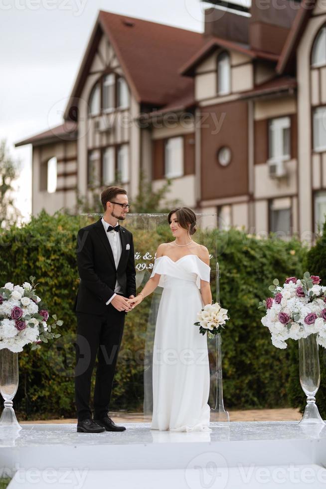 wedding ceremony of the newlyweds on the glade photo