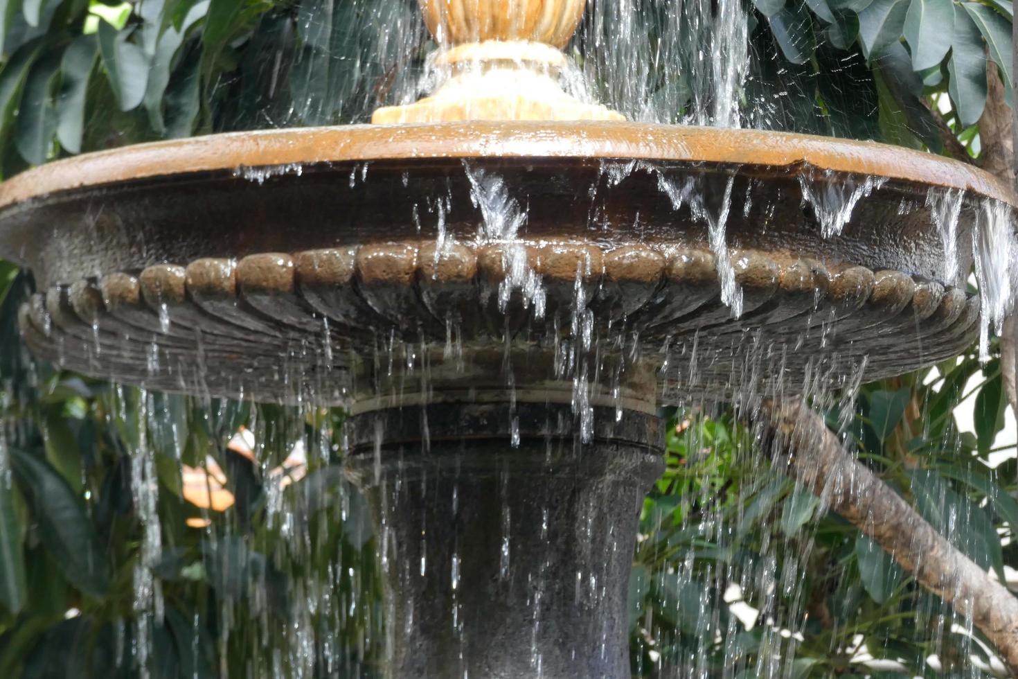 Urban ornamental water fountain in the city centre photo