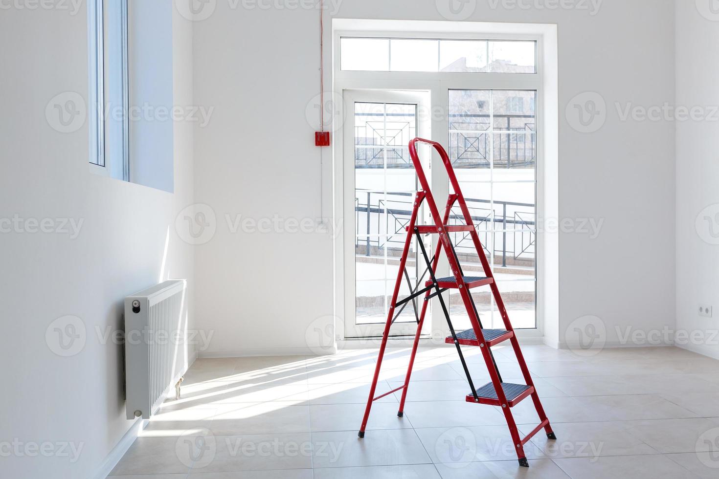 Office extension that uses bricks as a wall, construction, improvement. Interior of small room with window and bricks walls renovation, extension, overhaul and reconstruction. photo