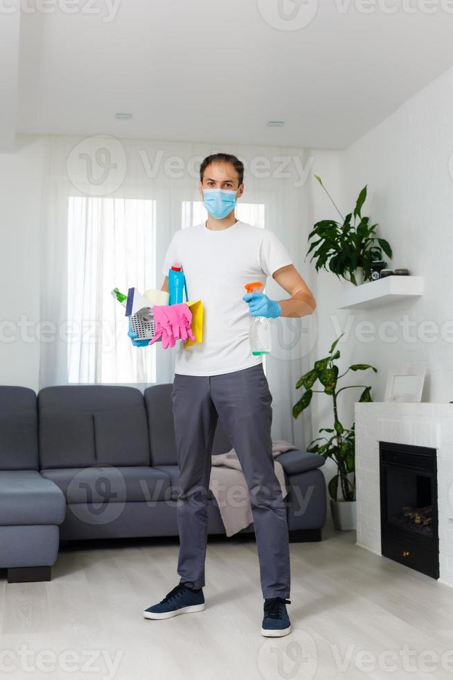 Cleaning and Disinfection at town complex amid the coronavirus epidemic. Professional teams for disinfection efforts. Infection prevention and control of epidemic. Protective gloves and mask photo