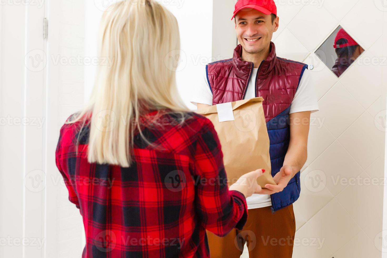 Driver holding paper bag, Delivering On Line Grocery Order photo