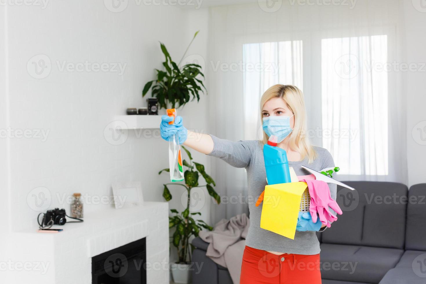 Woman cleaning kitchen. Coronavirus prevention and home disinfection. photo