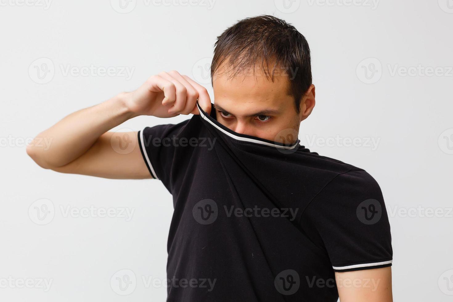 Close-up of a young man having a cough photo