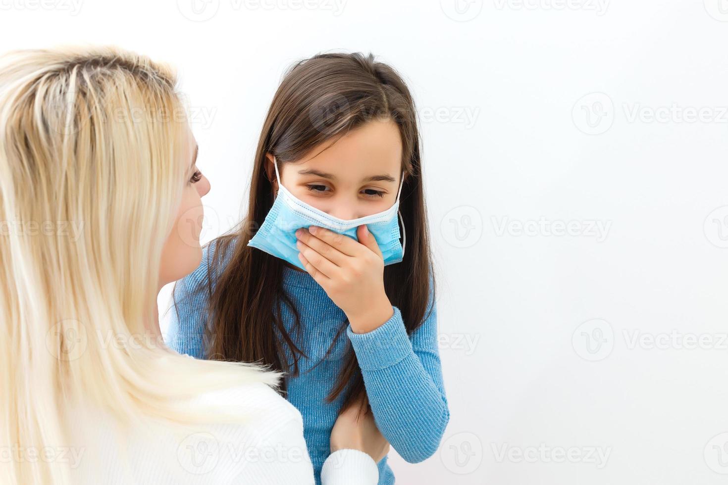 Protection against contagious disease, coronavirus concept. Mother and daughter wearing hygienic mask to prevent infection, respiratory illness such as flu, . minimize risk of Viral transmission. photo