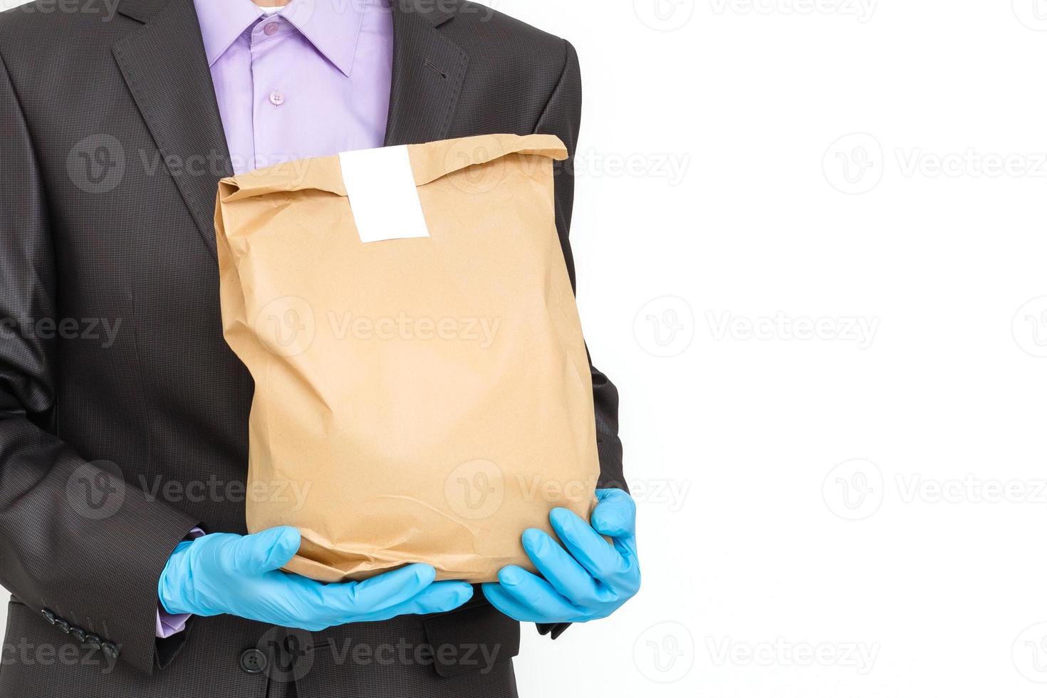 Young businessman wearing protective coronavirus medical mask on white background. Concept of health and safety life, N1H1 coronavirus, virus protection, pandemic in world photo