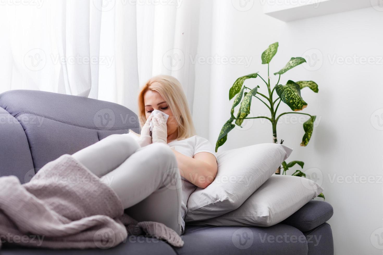 Sick Woman. Flu. Woman Caught Cold. Sneezing into Tissue. Headache. Virus. Medicines photo