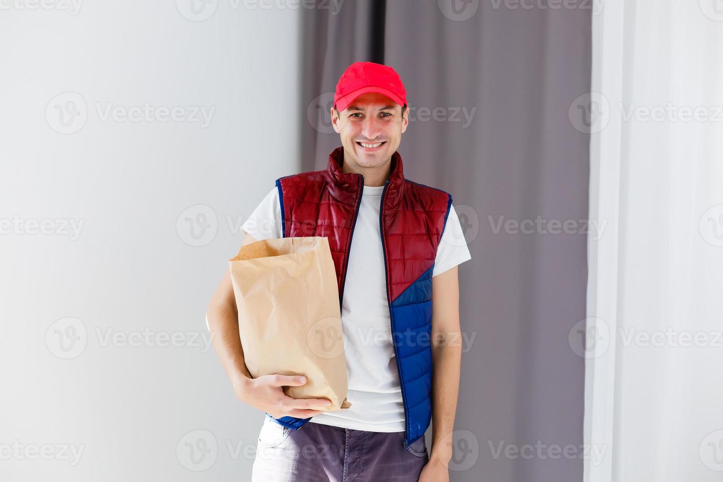 Paper container for takeaway food. Delivery man is carrying photo