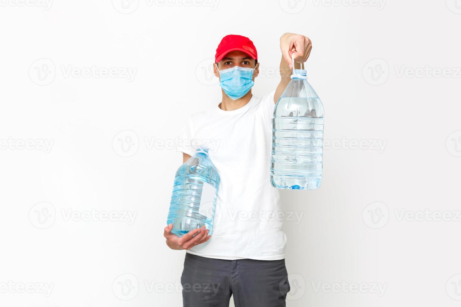 Strong water delivery man in protective mask. Isolated on white. photo