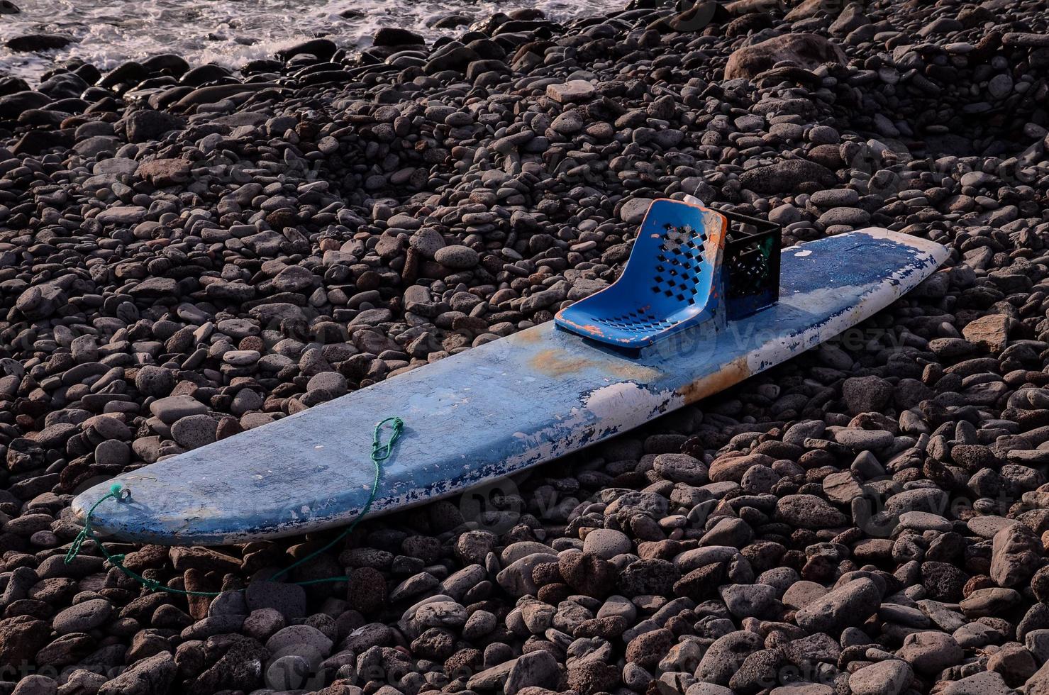 Paddle board on the shore photo