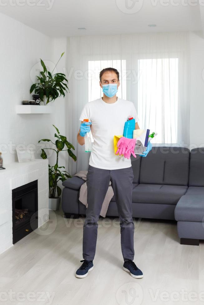 Cleaning and Disinfection at town complex amid the coronavirus epidemic. Professional teams for disinfection efforts. Infection prevention and control of epidemic. Protective gloves and mask photo