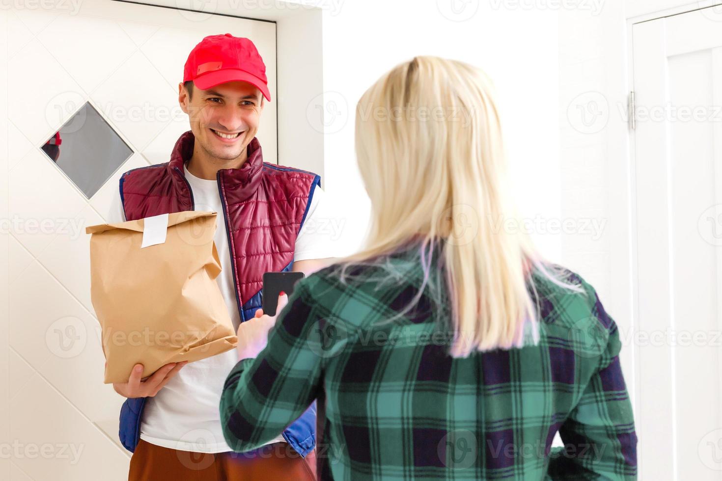 Driver holding paper bag, Delivering On Line Grocery Order photo