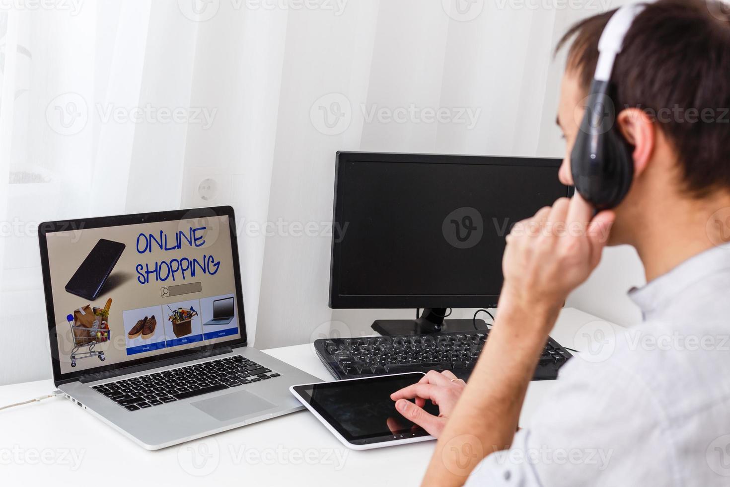 Cheerful support phone operator in headset at workplace photo